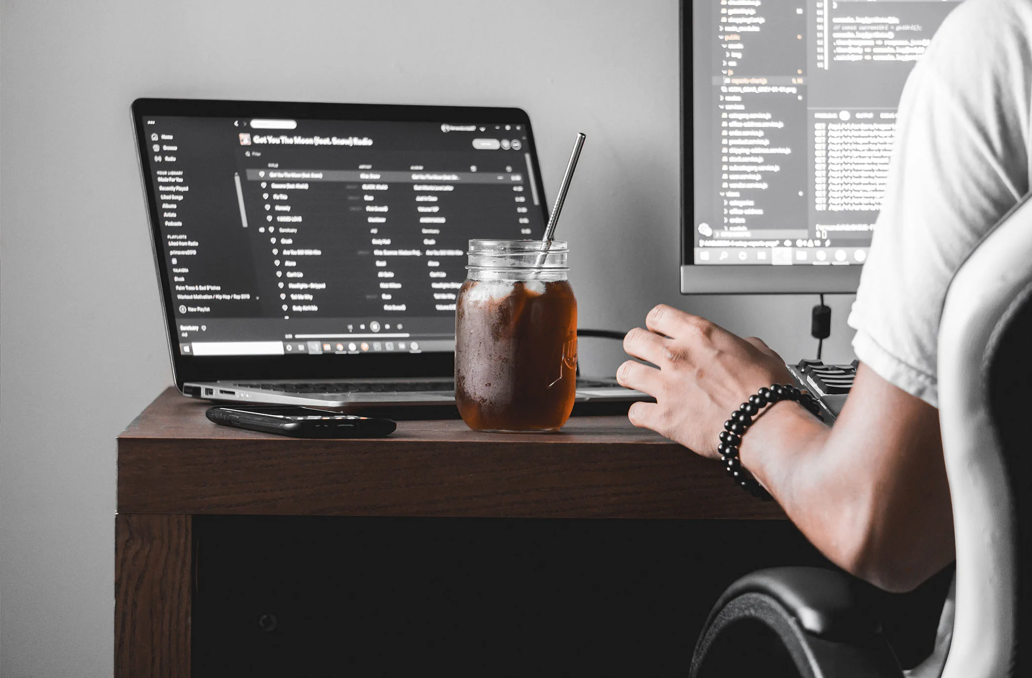 Laptop and external display at a software development workspace